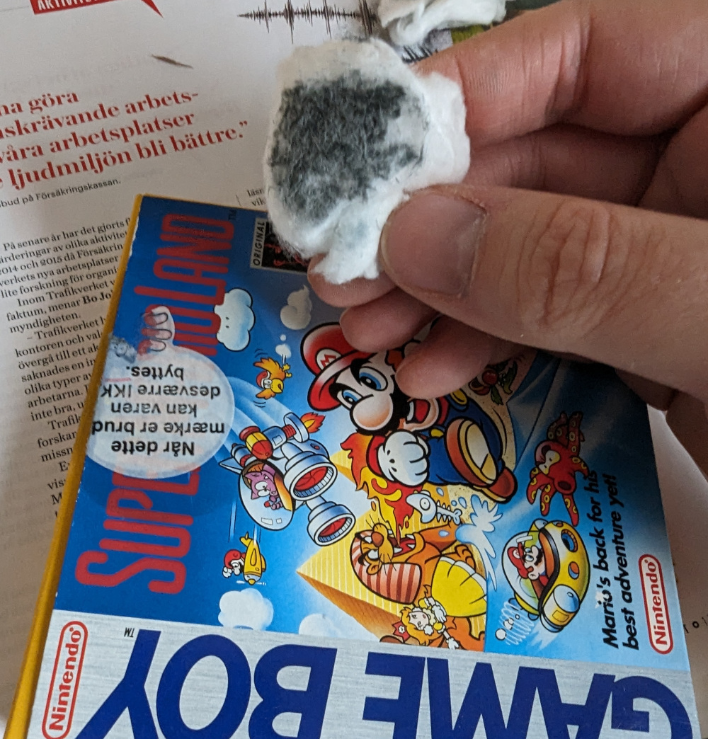 A cotton bud with the sticker's print ink coming off.